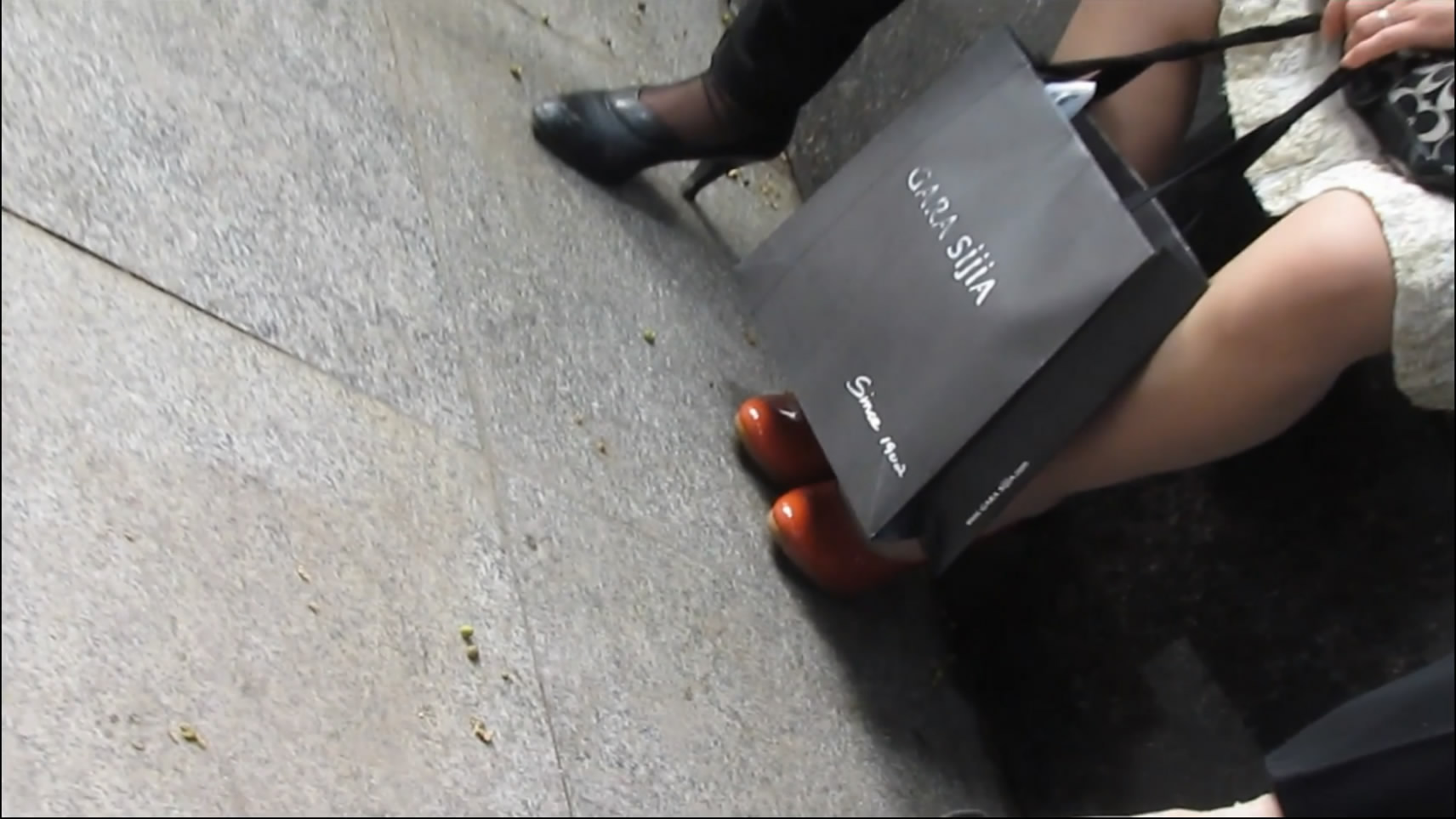 Talking and Sitting After Shopping with Friend in Shopping Center